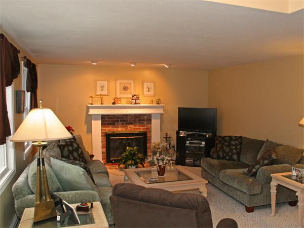 65 Young Road Ashburnham, MA 01430 - Photo 7 of 22 a living room with furniture and a fireplace