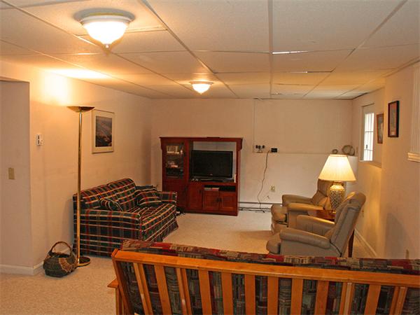 65 Young Road Ashburnham, MA 01430 - Photo 9 of 22 a bedroom with furniture and a flat screen tv