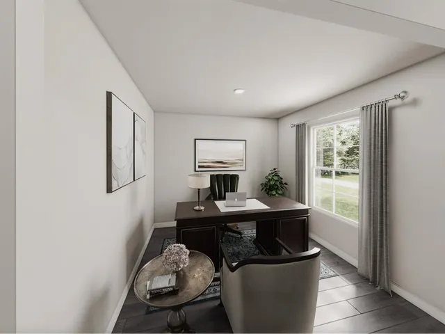 a workspace with furniture and window