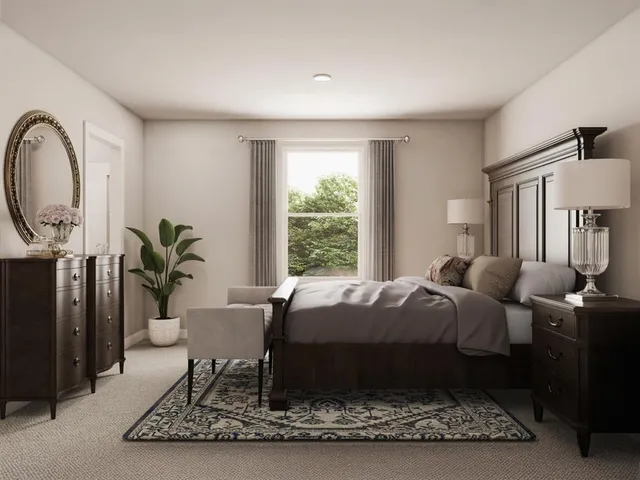 a bed room with a bed a chair a potted plant and a window