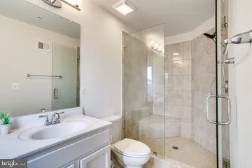 a bathroom with a sink toilet tub and shower