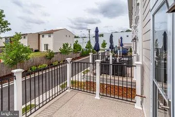 a view of a house with iron fence