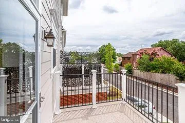 a view of a balcony with wooden fence