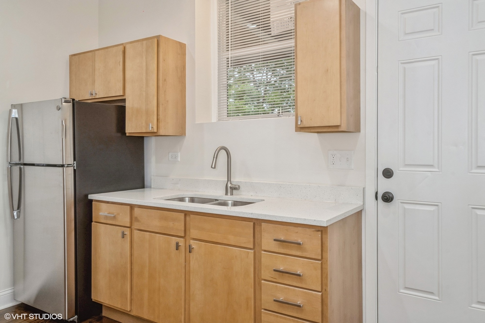 5027-29 West Washington Boulevard Chicago, IL 60644 - Photo 11 of 33 a kitchen with a sink cabinets and a refrigerator
