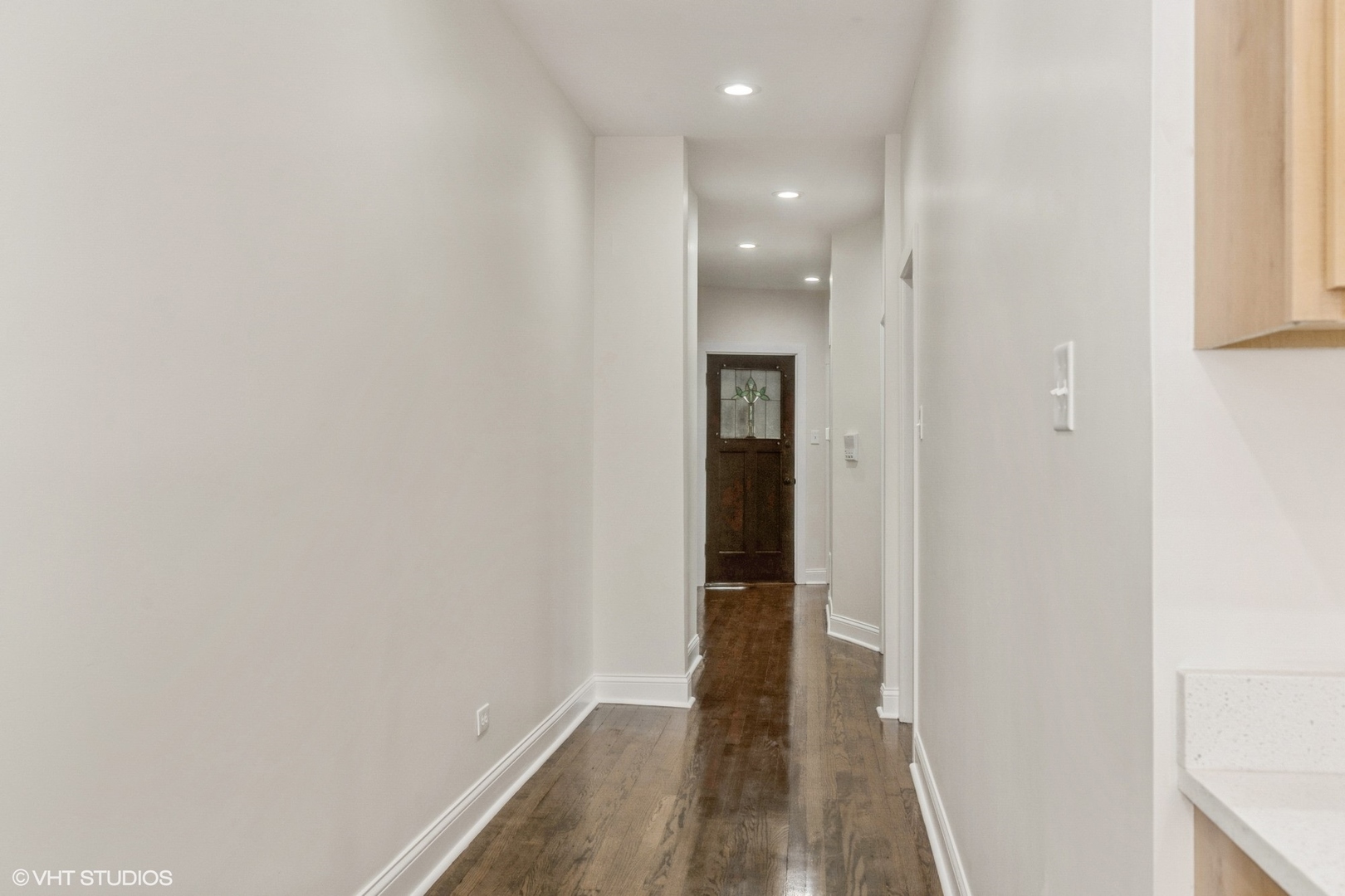5027-29 West Washington Boulevard Chicago, IL 60644 - Photo 13 of 33 a view of hallway with wooden floor