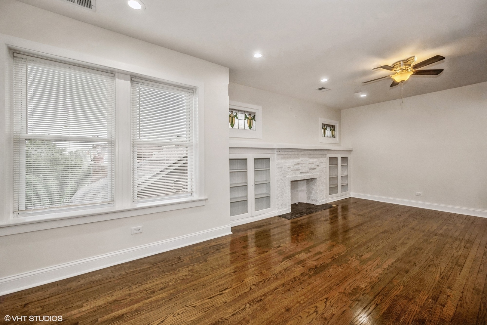 5027-29 West Washington Boulevard Chicago, IL 60644 - Photo 9 of 33 a view of an empty room with a window and wooden floor