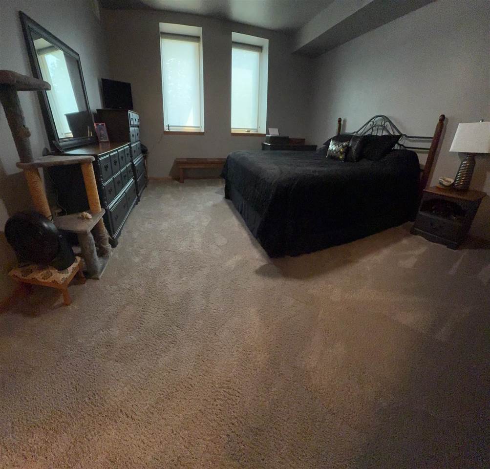251 Vine Street, Unit 102 Riverside, IA 52327 - Photo 15 of 25 Master Bedroom