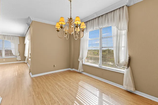 a view of hallway with wooden floor