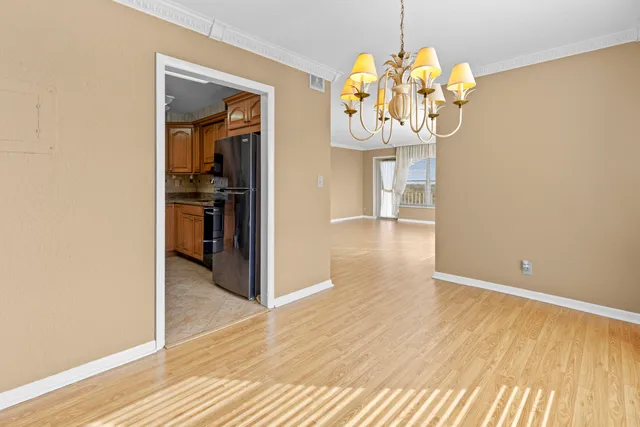 a kitchen with a stove a sink and a refrigerator