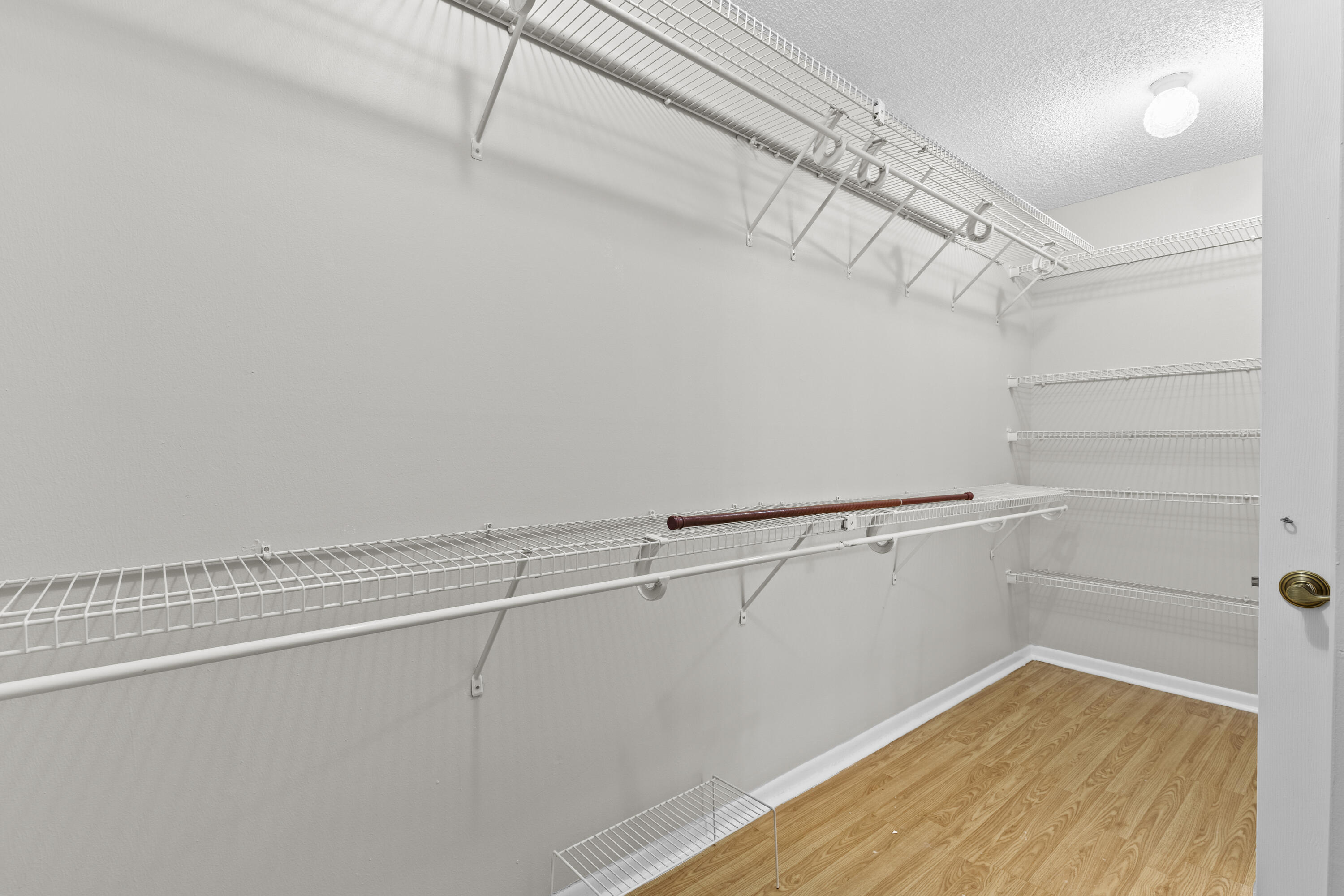 10777 West Sample Road, Unit 719 Coral Springs, FL 33065 - Photo 26 of 44 a view of a room with racks on the wall