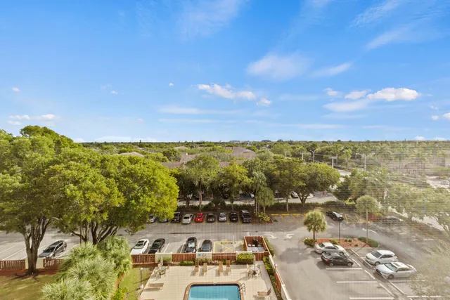 a lobby with furniture and a potted plant