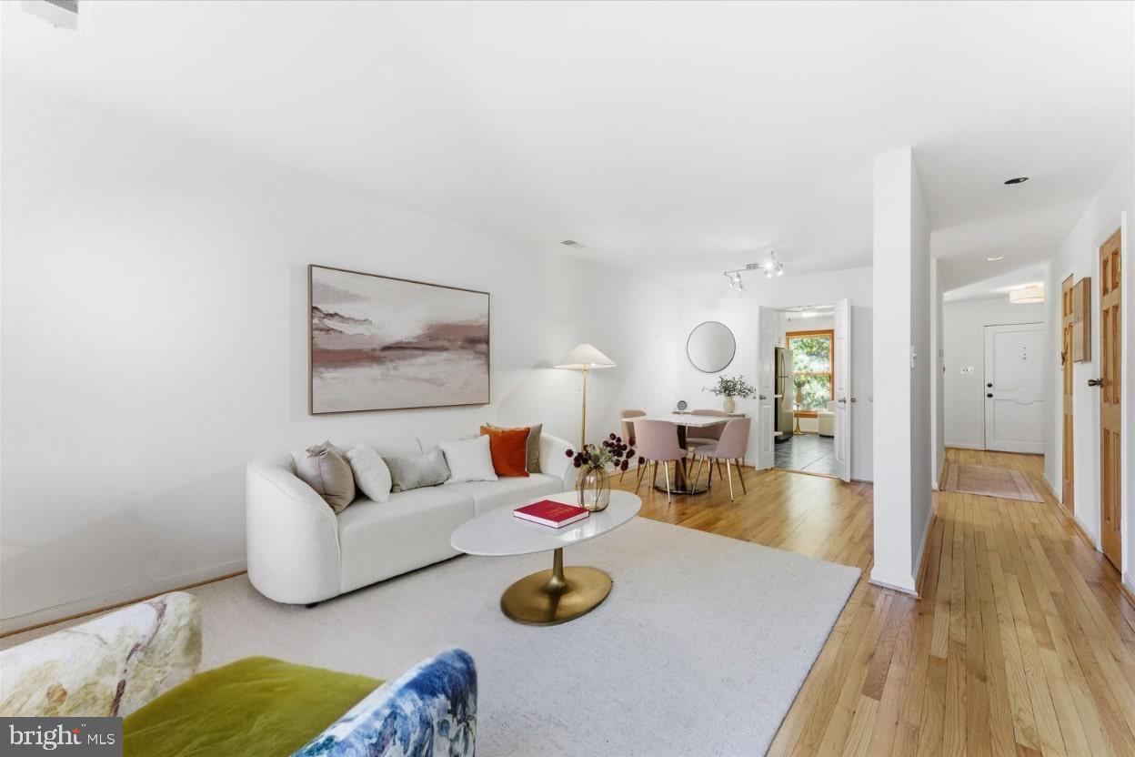 1645 Park Road Northwest Washington, DC 20010 - Photo 11 of 28 a living room with furniture and wooden floor