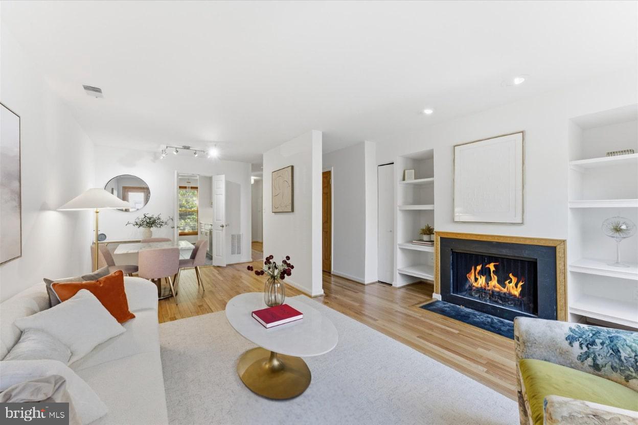 1645 Park Road Northwest Washington, DC 20010 - Photo 12 of 28 a living room with furniture and a fireplace