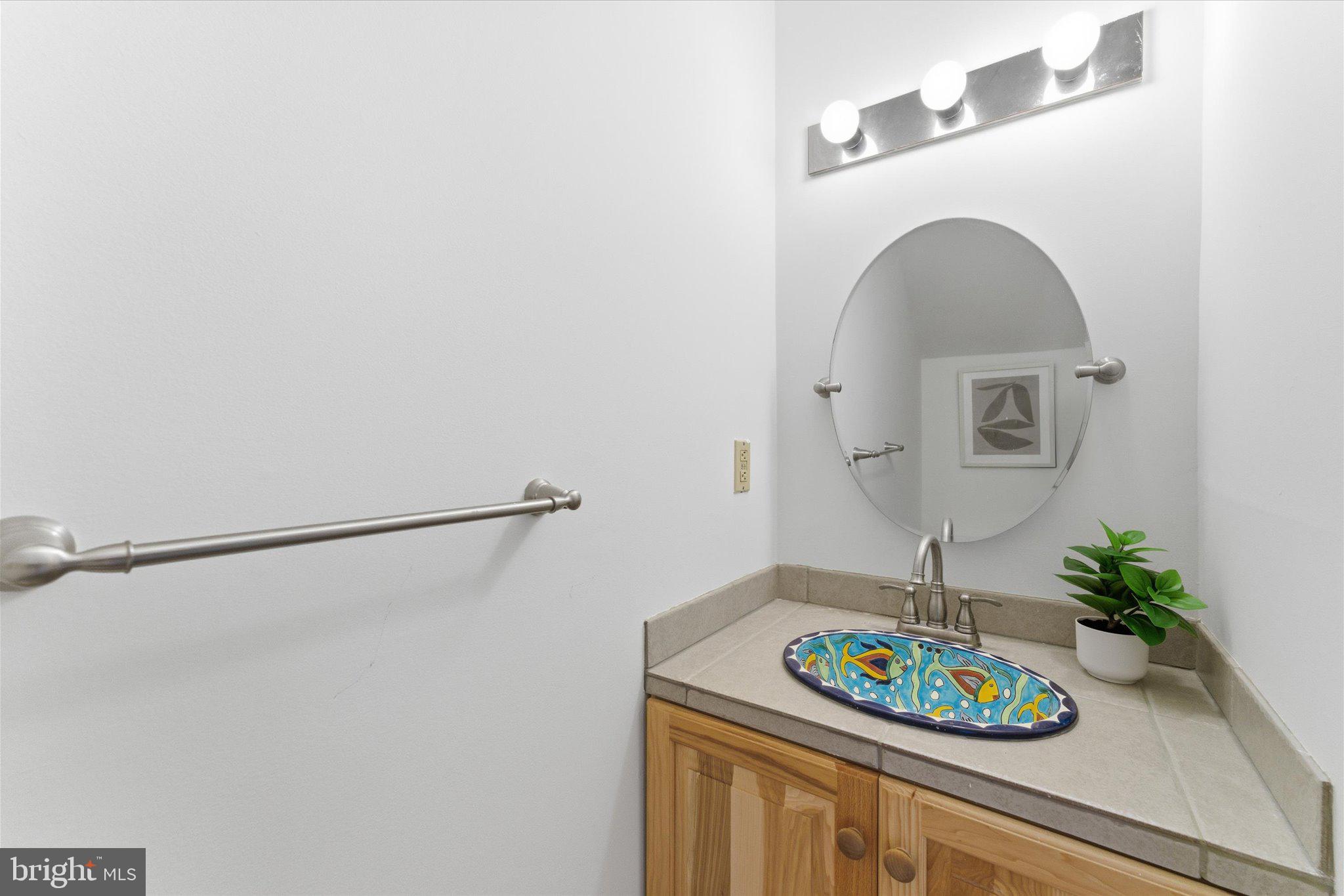 1645 Park Road Northwest Washington, DC 20010 - Photo 13 of 28 a table with a vase and flowers on it