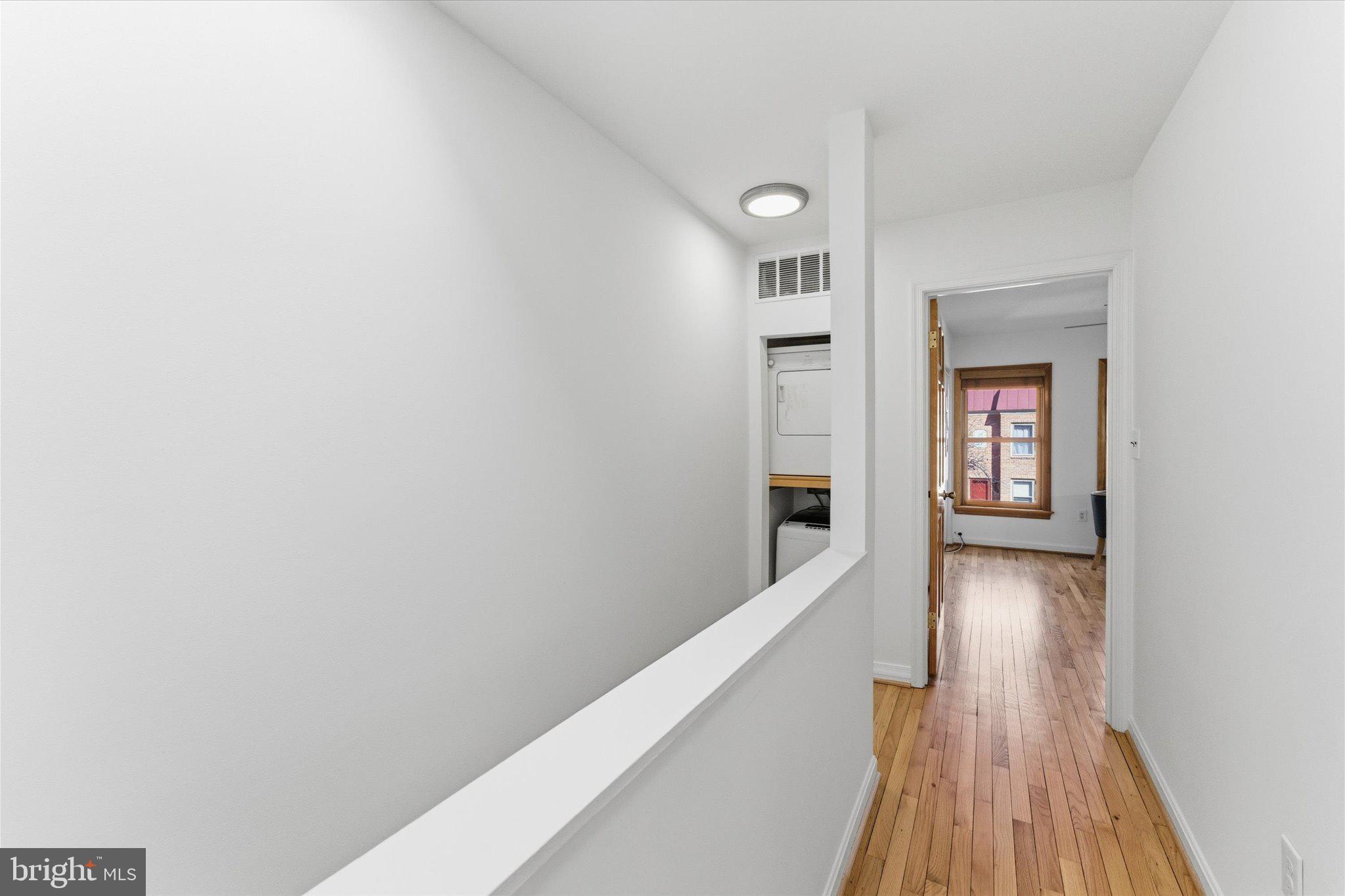 1645 Park Road Northwest Washington, DC 20010 - Photo 16 of 28 a view of a hallway with wooden floor