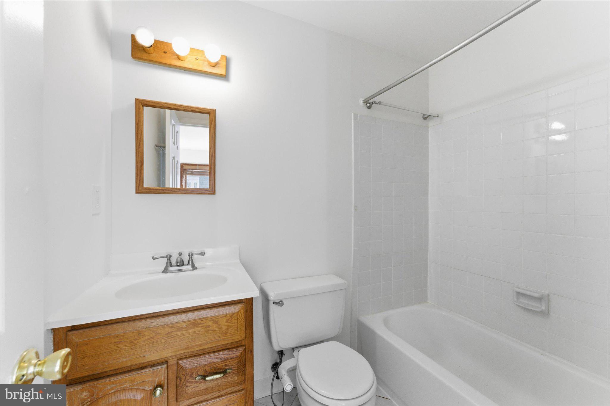 1645 Park Road Northwest Washington, DC 20010 - Photo 24 of 28 a bathroom with a toilet a sink and bathtub