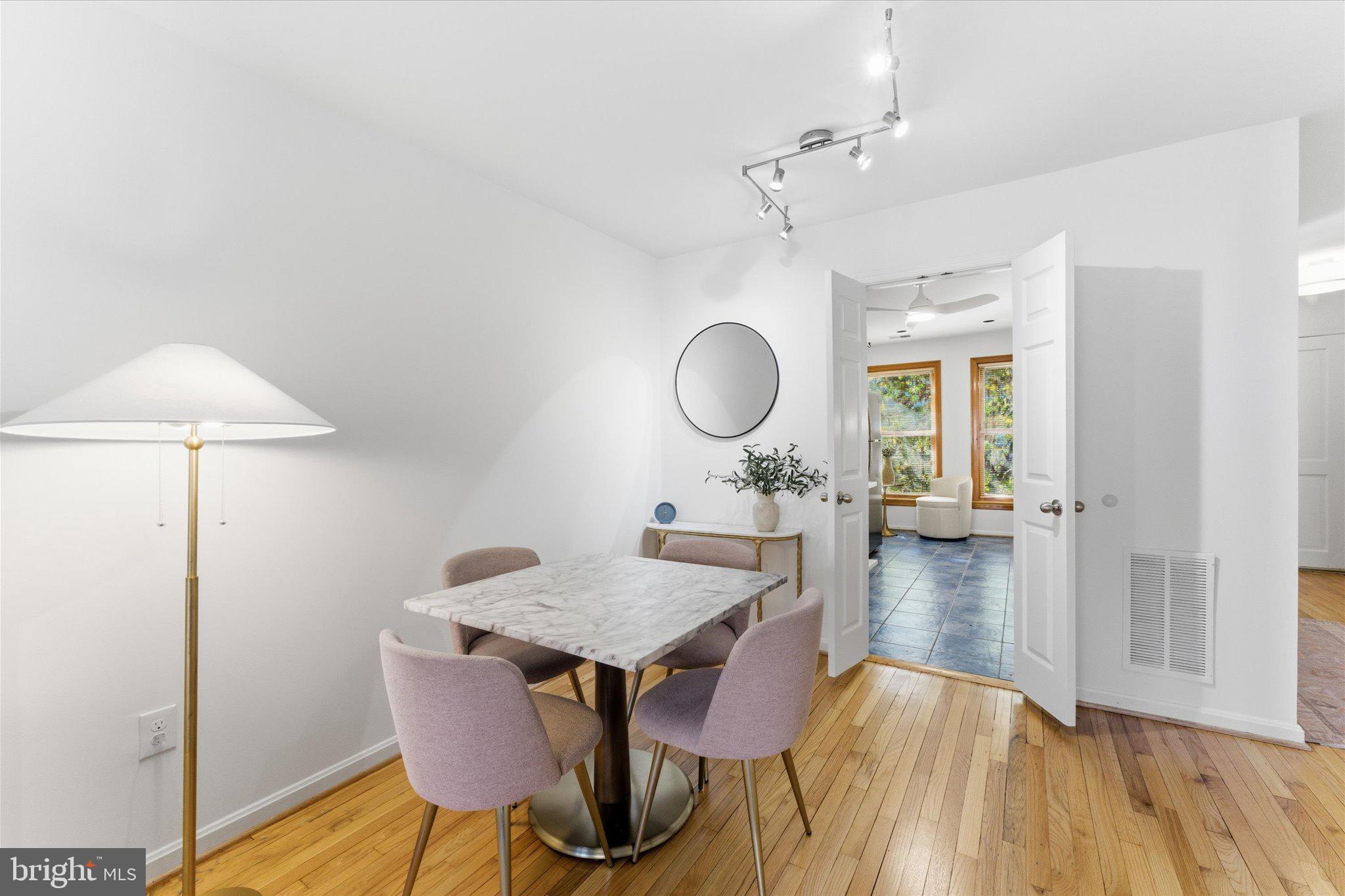 1645 Park Road Northwest Washington, DC 20010 - Photo 8 of 28 a view of a dining room with furniture and wooden floor