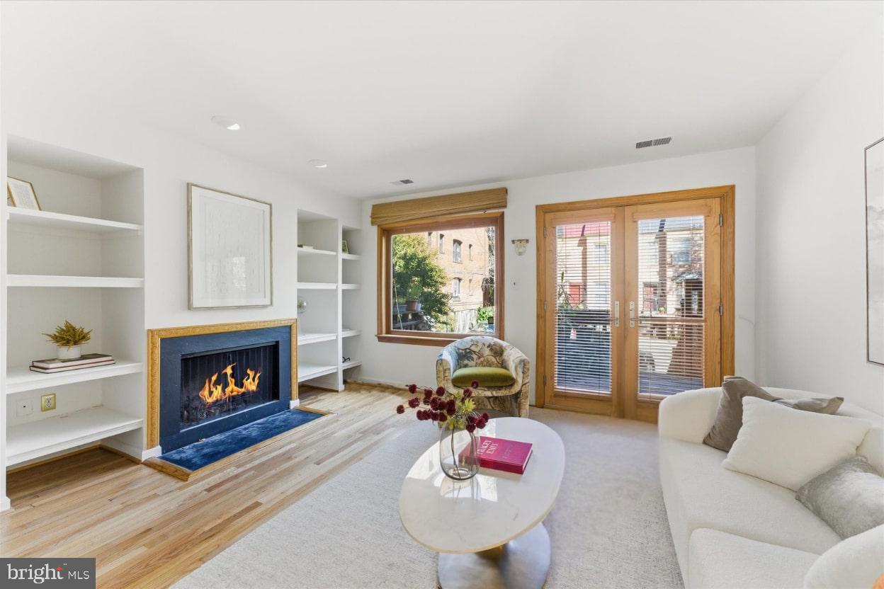 1645 Park Road Northwest Washington, DC 20010 - Photo 10 of 28 a living room with furniture fireplace and window