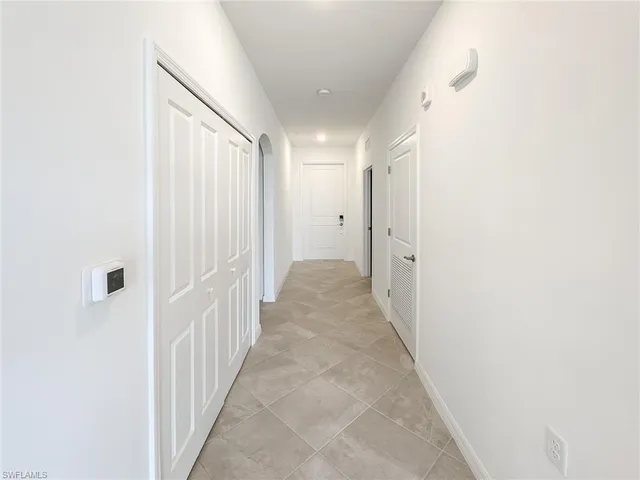 a view of a hallway with white walls