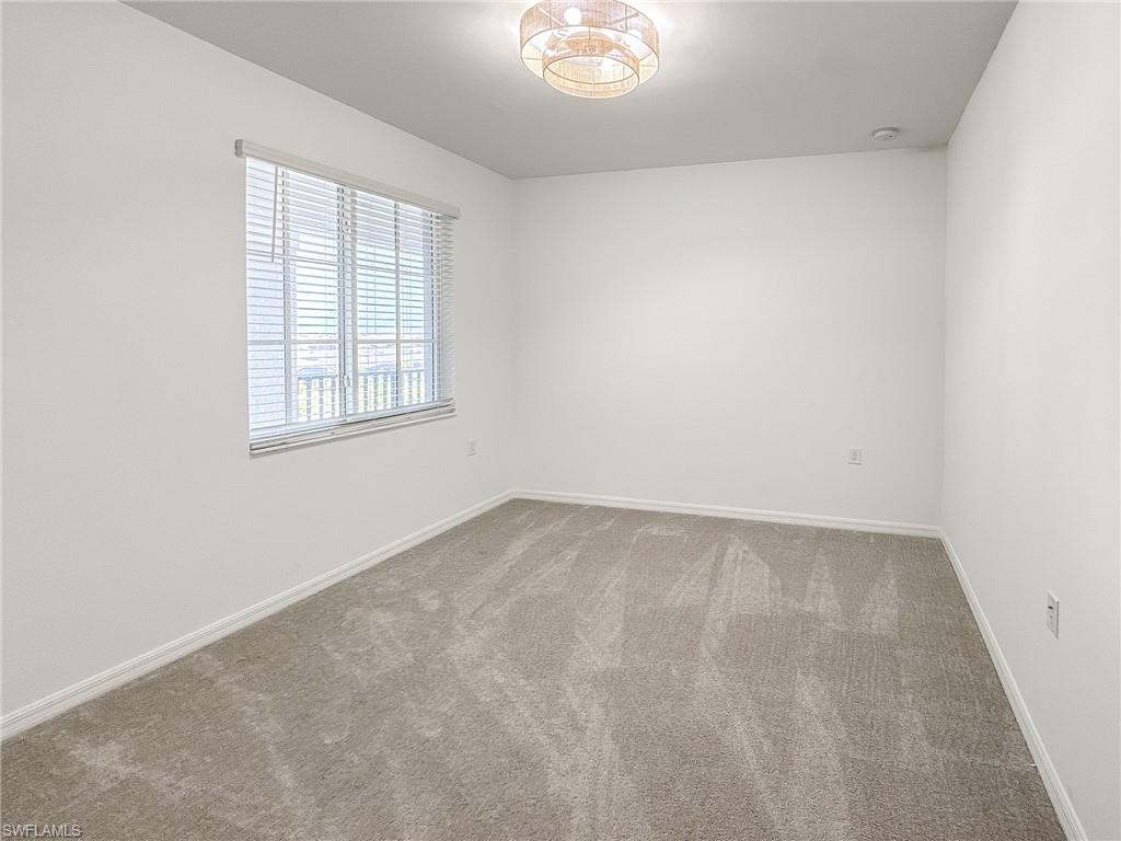 5583 Double Eagle Circle, Unit 4141 Ave Maria, FL 34142 - Photo 19 of 50 an empty room with a window
