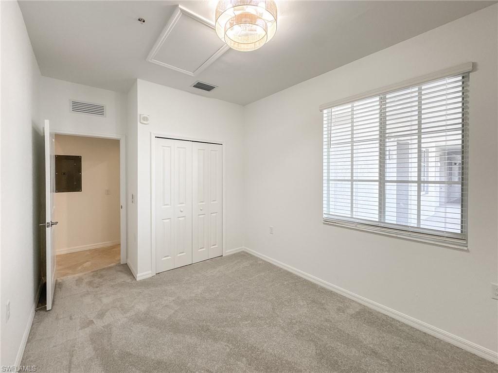 5583 Double Eagle Circle, Unit 4141 Ave Maria, FL 34142 - Photo 20 of 50 a view of an empty room with a window
