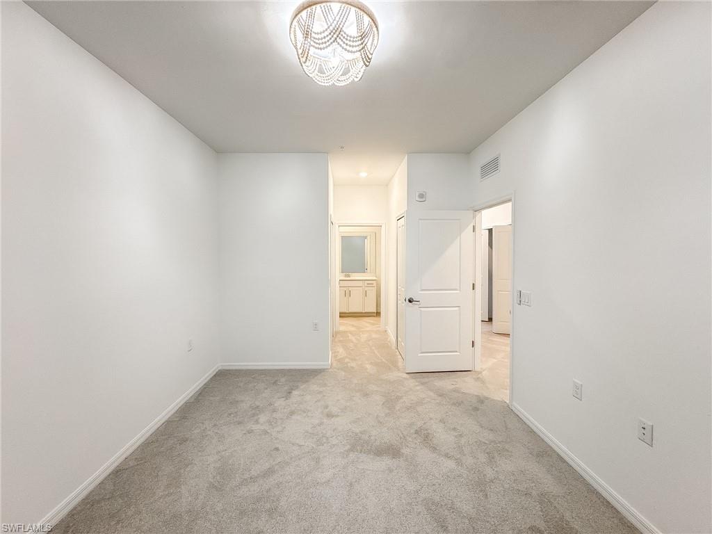 5583 Double Eagle Circle, Unit 4141 Ave Maria, FL 34142 - Photo 23 of 50 wooden floor in an empty room