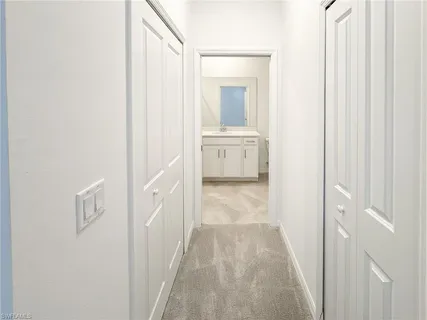 a view of a bathroom from the hallway