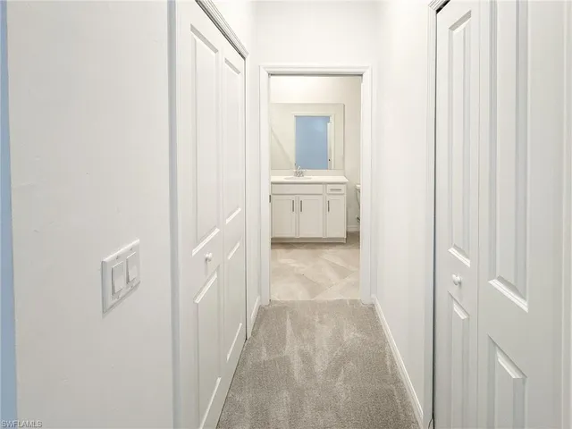 a view of a bathroom from the hallway