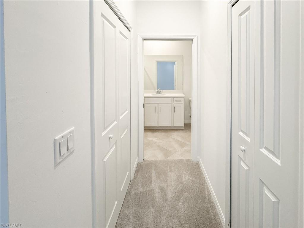 5583 Double Eagle Circle, Unit 4141 Ave Maria, FL 34142 - Photo 24 of 50 a view of a bathroom from the hallway