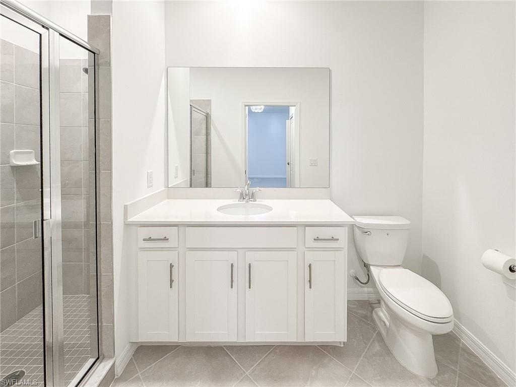 5583 Double Eagle Circle, Unit 4141 Ave Maria, FL 34142 - Photo 25 of 50 a bathroom with a sink a toilet and shower