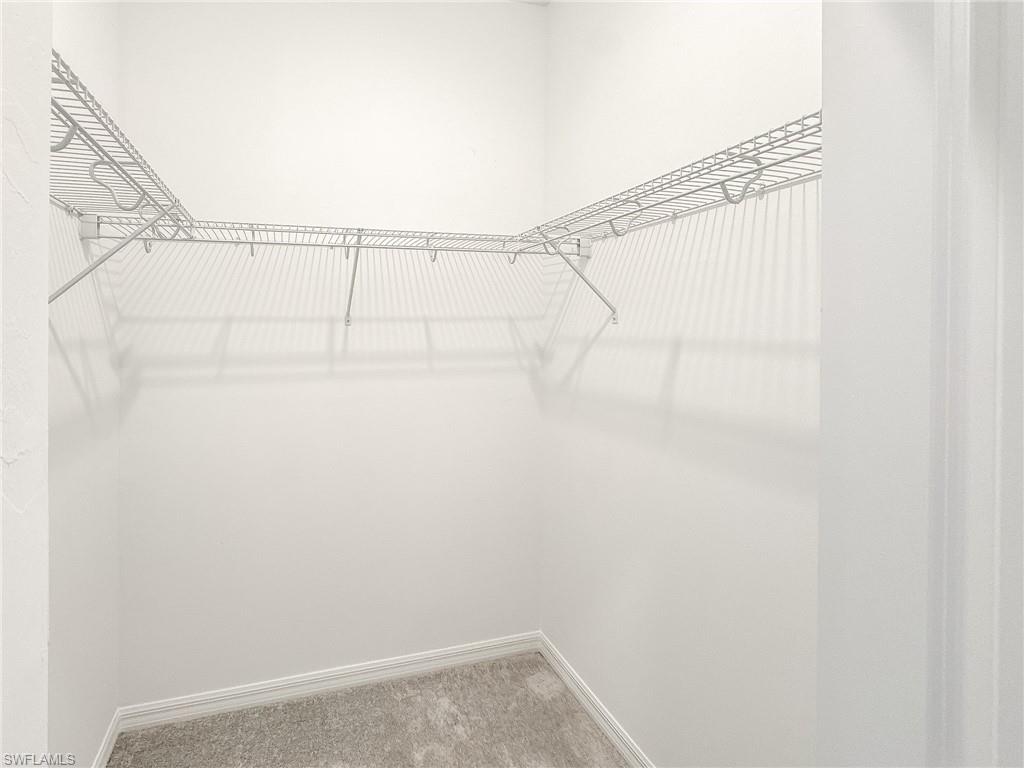 5583 Double Eagle Circle, Unit 4141 Ave Maria, FL 34142 - Photo 28 of 50 a view of small space with racks on the wall