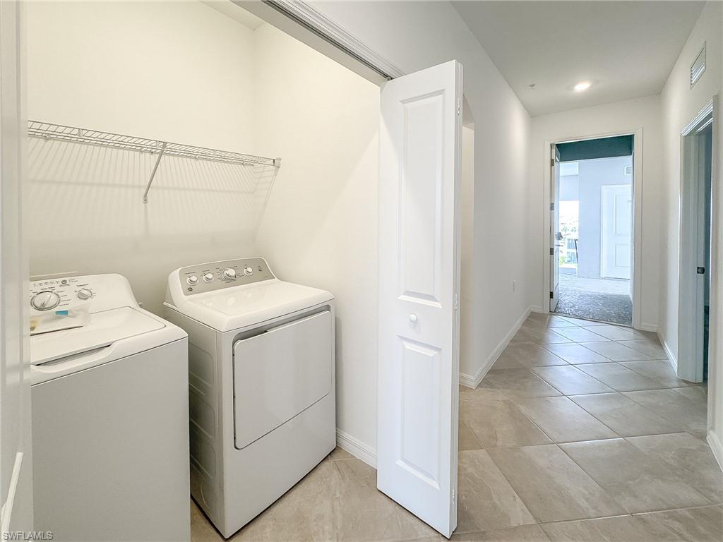 5583 Double Eagle Circle, Unit 4141 Ave Maria, FL 34142 - Photo 29 of 50 a view of utility room with washer and dryer
