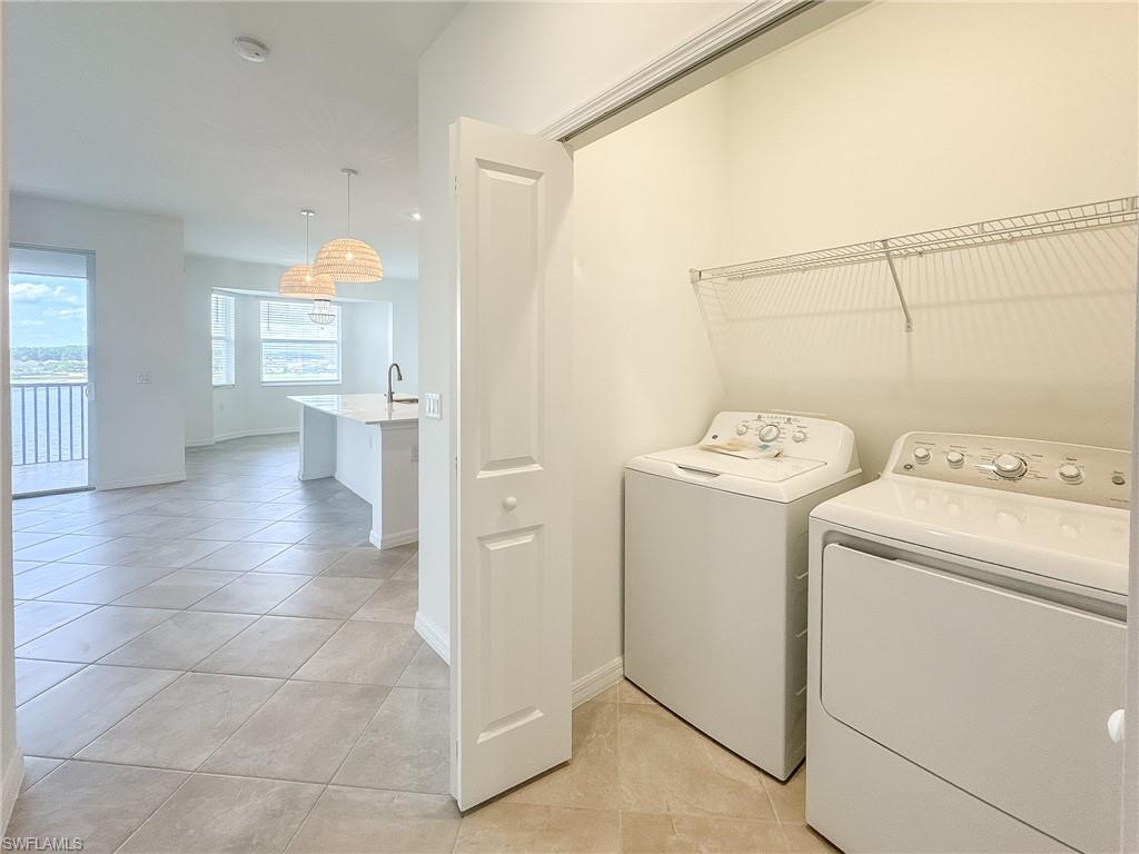 5583 Double Eagle Circle, Unit 4141 Ave Maria, FL 34142 - Photo 30 of 50 a view of a storage & utility room with dryer and washer