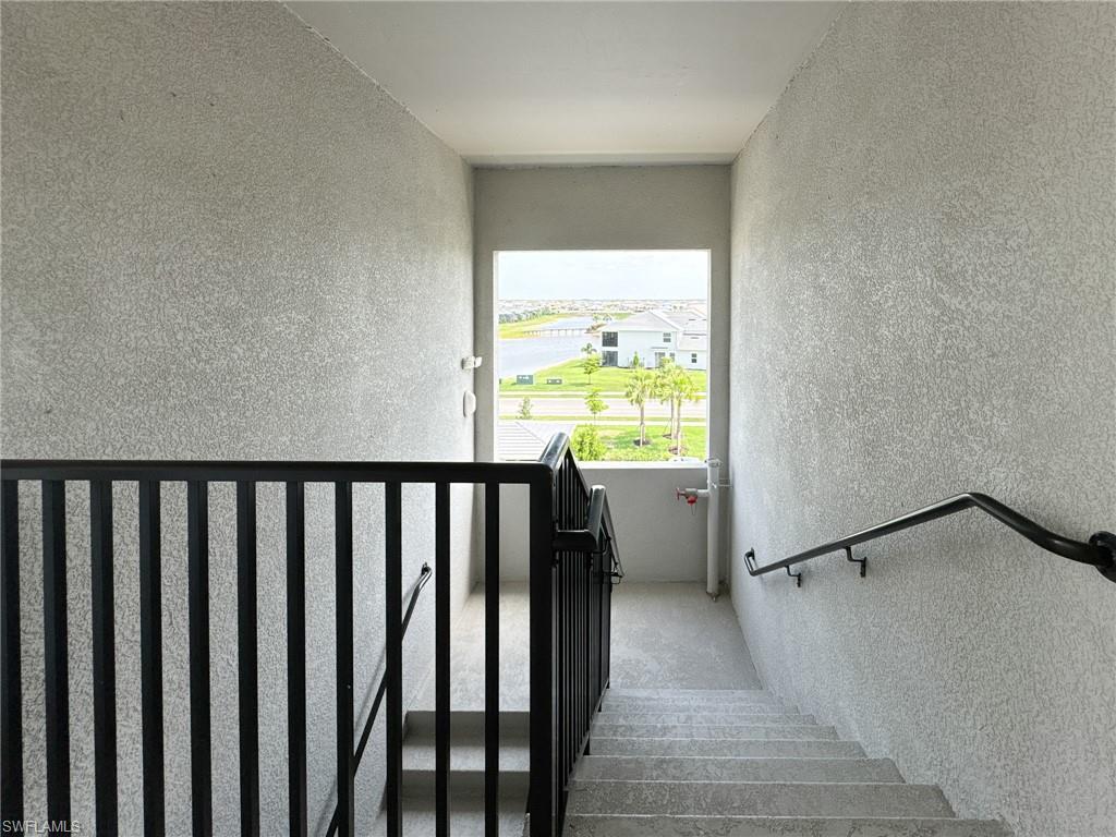 5583 Double Eagle Circle, Unit 4141 Ave Maria, FL 34142 - Photo 34 of 50 a view of a balcony with wooden floor