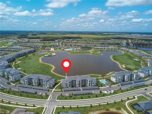 a view of swimming pool with a table and chairs