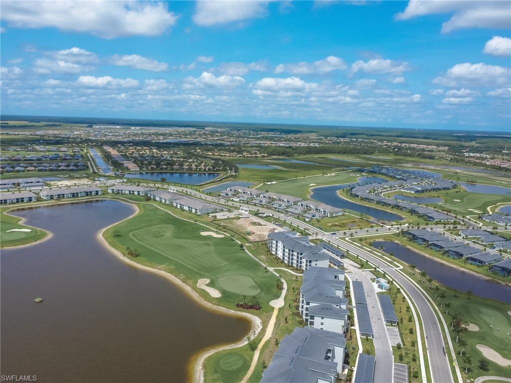 5583 Double Eagle Circle, Unit 4141 Ave Maria, FL 34142 - Photo 37 of 50 a view of a lake from a balcony