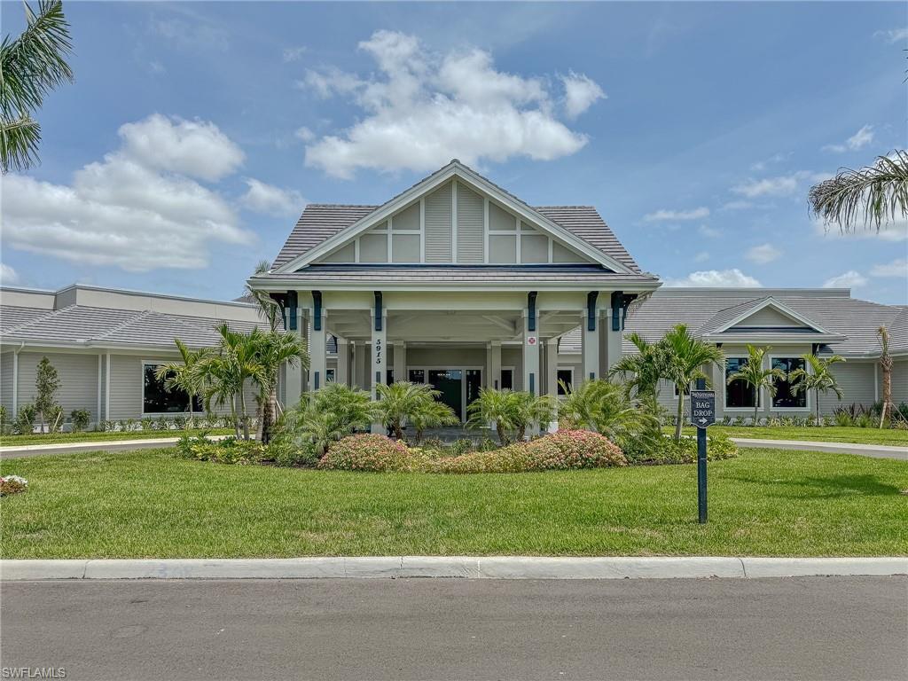 5583 Double Eagle Circle, Unit 4141 Ave Maria, FL 34142 - Photo 38 of 50 a front view of house with a garden