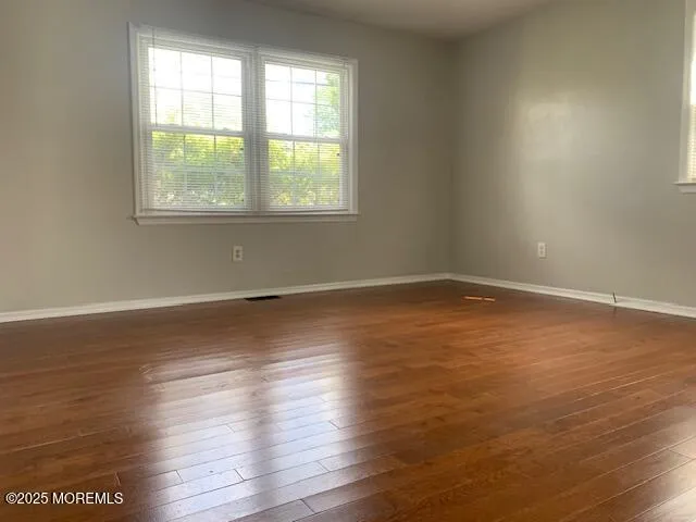 a bathroom with a toilet and a window