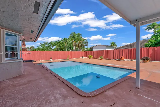 a view of an outdoor space with swimming pool