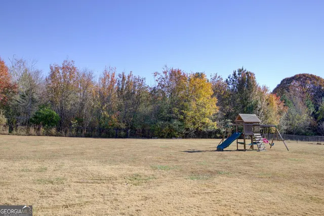 a patio with a table and chairs