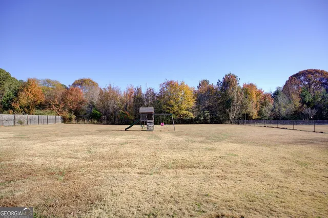 a front view of house with outdoor space and parking