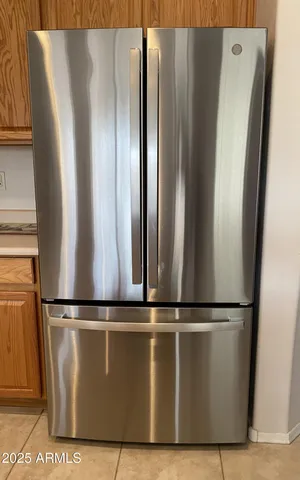 a stove top oven sitting inside of a kitchen