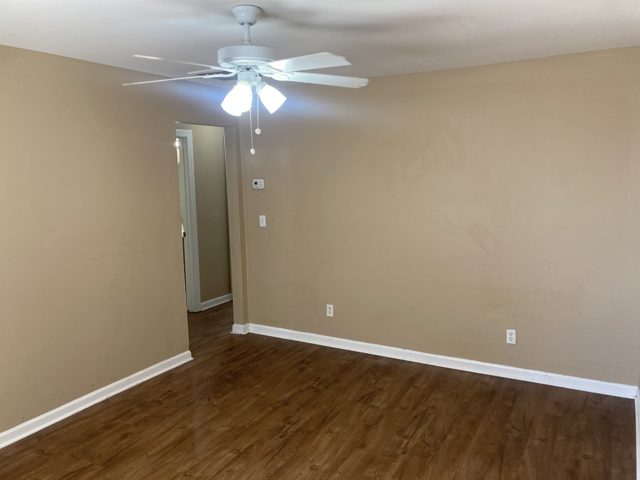 1811 16th Avenue North, Unit B Nashville, TN 37208 - Photo 5 of 13 a view of an empty room with wooden floor