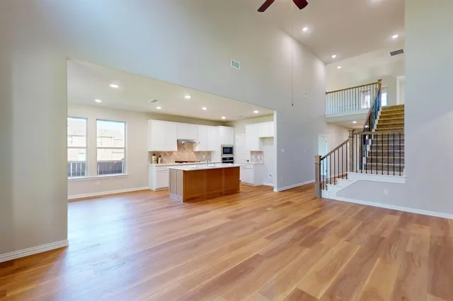 a view of kitchen with wooden floor and window