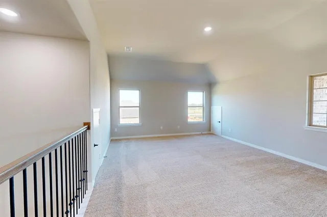 a view of empty room with windows