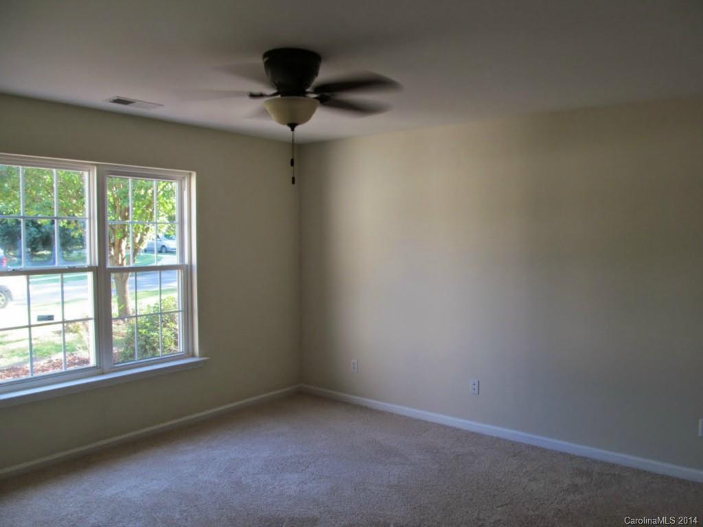 5209 Javitz Road Charlotte, NC 28216 - Photo 5 of 10 an empty room with a window