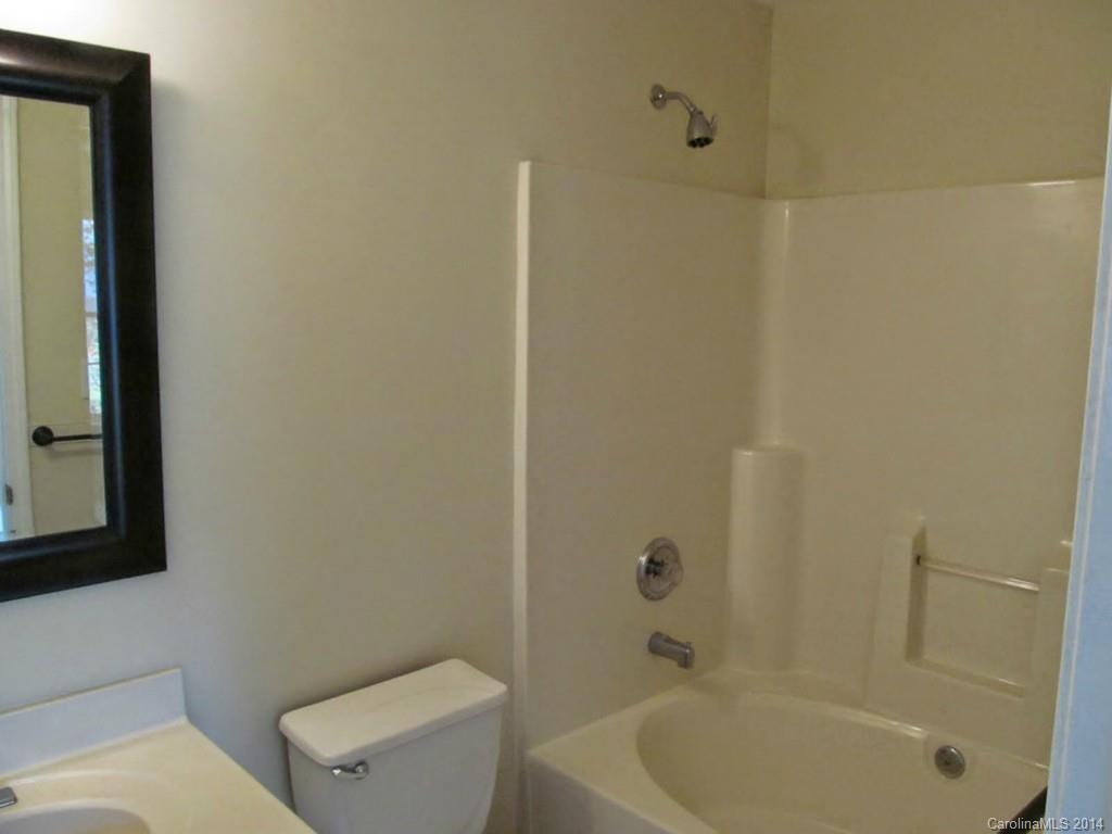 5209 Javitz Road Charlotte, NC 28216 - Photo 6 of 10 a bathroom with a toilet and a tub