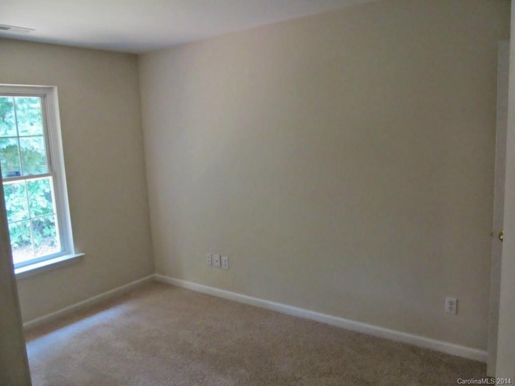 5209 Javitz Road Charlotte, NC 28216 - Photo 7 of 10 an empty room with a window
