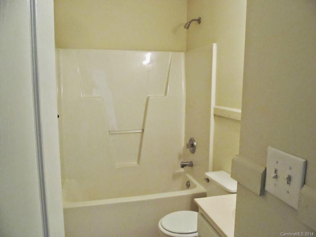 5209 Javitz Road Charlotte, NC 28216 - Photo 8 of 10 a bathroom with a shower and a toilet
