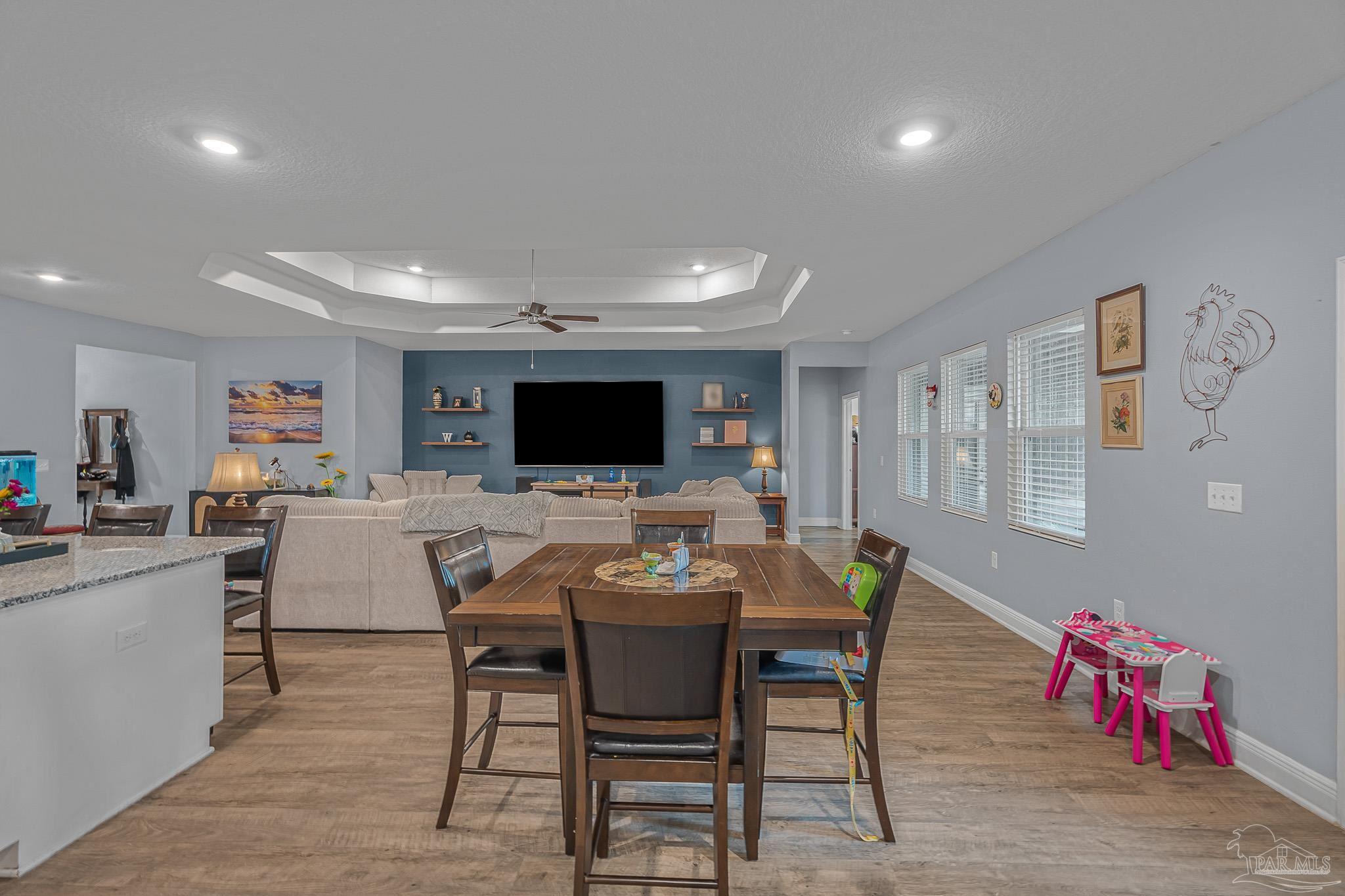 355 Cayden Way Cantonment, FL 32533 - Photo 17 of 61 a view of a dining room with furniture and wooden floor